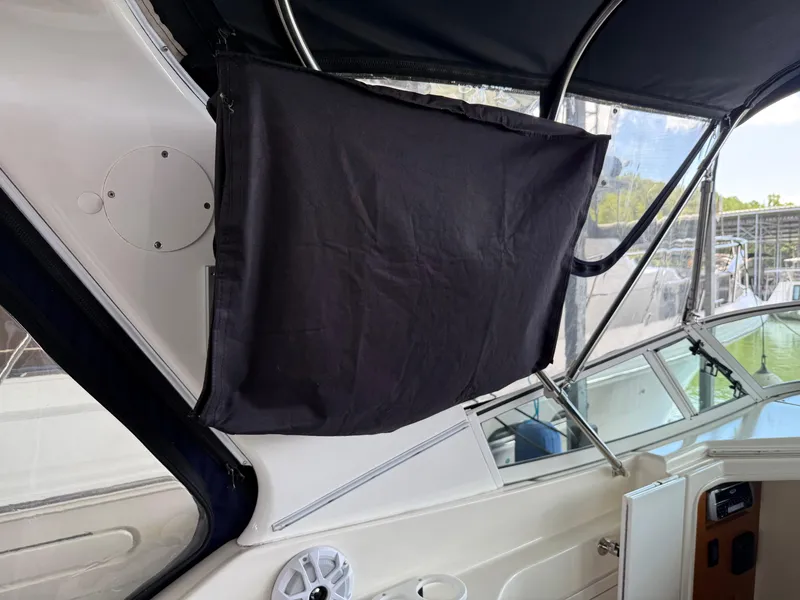 Slide: The Image of 2004 Cruisers Yachts 280 Express interior with covered equipment and speaker. - 29