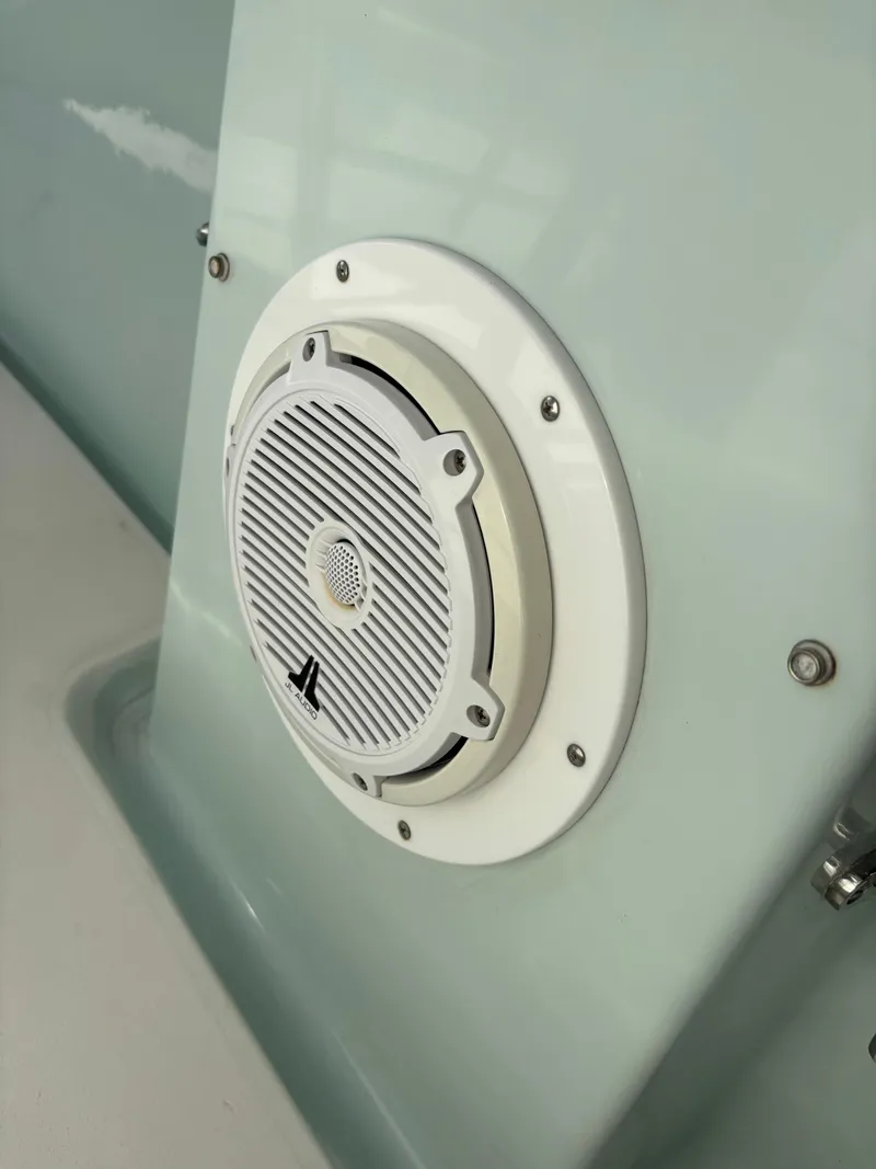 Slide: The Image of White speaker on a 1998 Intrepid 327 Cuddy boat interior. - 31