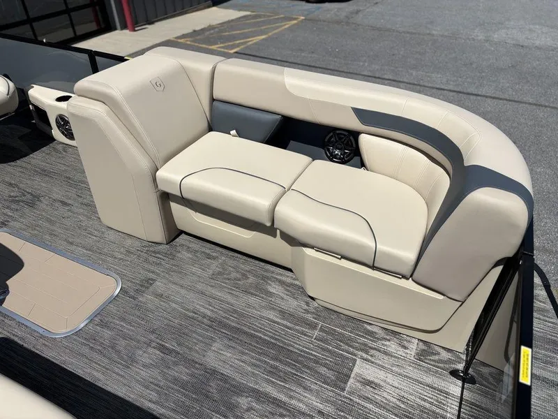 Slide: The Image of 2026 Godfrey SWEETWATER 2286 SFL boat interior with beige seating and gray flooring. - 15