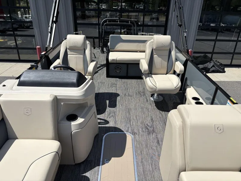 Slide: The Image of 2026 Godfrey SWEETWATER 2286 SFL pontoon boat interior with beige seating and modern design. - 16