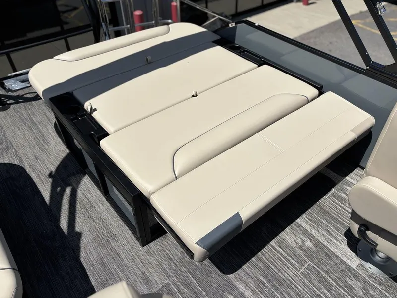 Slide: The Image of 2026 Godfrey SWEETWATER 2286 SFL boat seating, beige upholstery, outdoor setting. - 19
