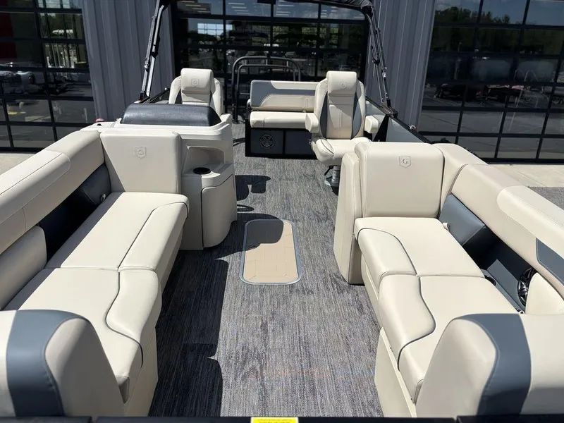Slide: The Image of 2026 Godfrey SWEETWATER 2286 SFL pontoon boat interior with beige seating and modern design. - 3