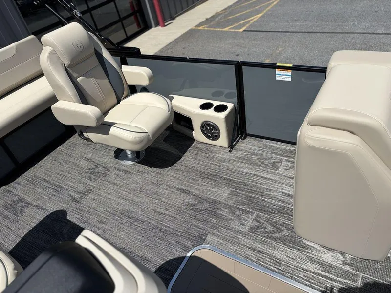 Slide: The Image of Interior of 2026 Godfrey SWEETWATER 2286 SFL pontoon boat with beige seating and flooring. - 9