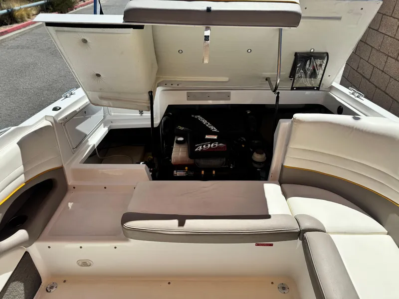 Slide: The Image of 2006 Cobalt 246 boat interior with open engine compartment, showcasing Mercury 496 engine. - 21