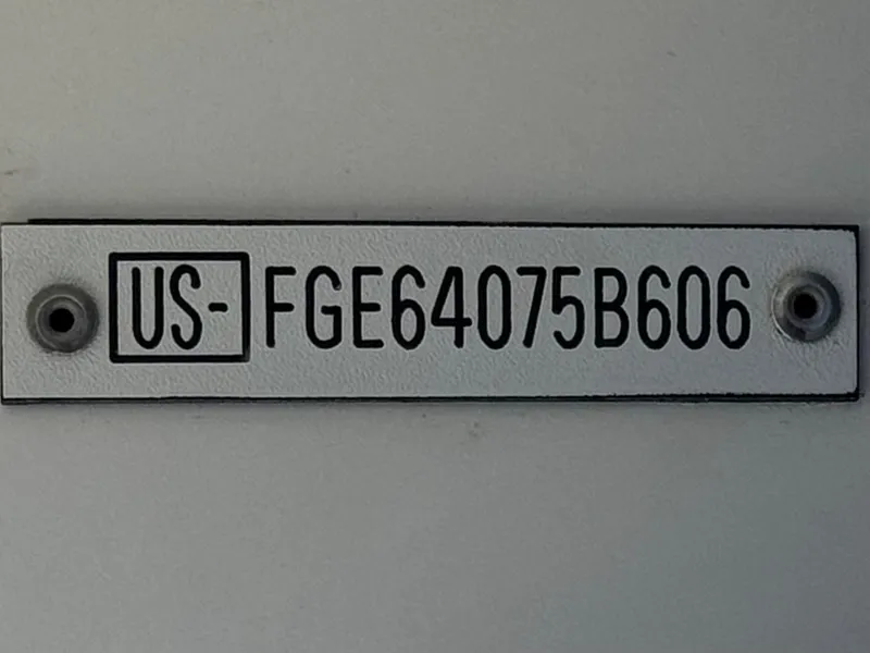 Slide: The Image of Hull identification number plate on a 2006 Cobalt 246 boat. - 32