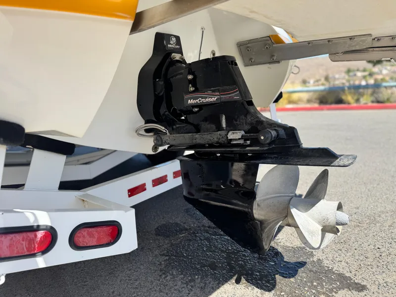 Slide: The Image of 2006 Cobalt 246 boat with MerCruiser outdrive and propeller, on a trailer. - 6