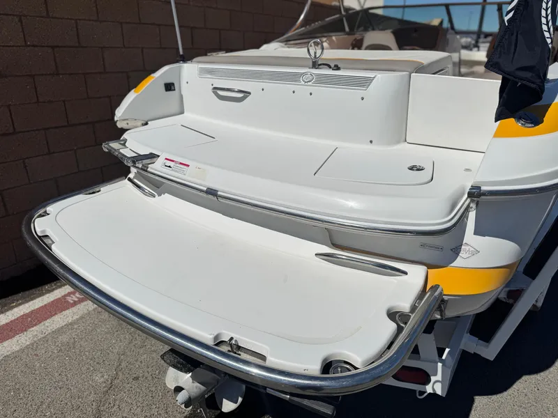 Slide: The Image of 2006 Cobalt 246 boat rear view with swim platform and ladder. - 7