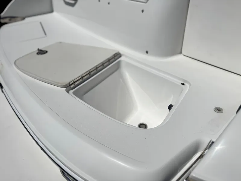 Slide: The Image of Open storage compartment on a 2006 Cobalt 246 boat deck. - 8