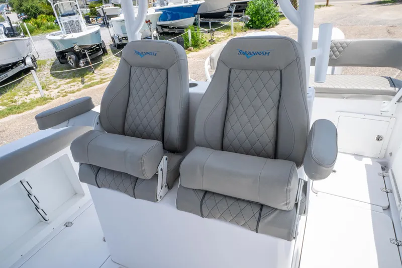 Slide: The Image of 2024 Savannah 2900 Offshore boat seats with diamond stitching and armrests. - 10