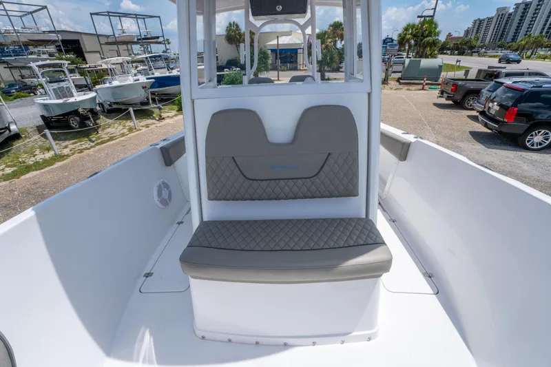 Slide: The Image of 2024 Savannah 2900 Offshore boat interior with cushioned seating and modern design. - 13