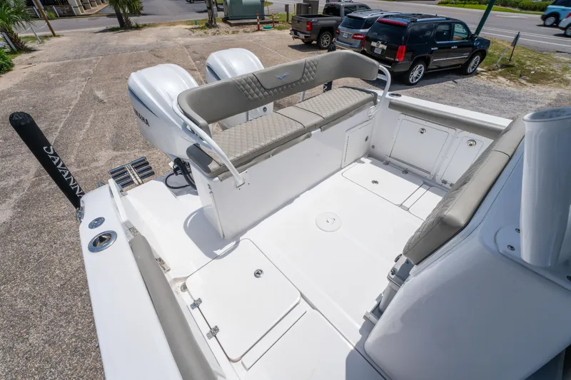 Slide: The Image of 2024 Savannah 2900 Offshore boat interior with seating and dual engines. - 8