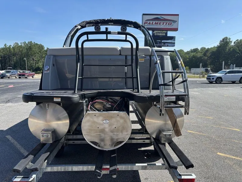 Slide: The Image of 2026 Godfrey AquaPatio 255 ULC pontoon boat on trailer at dealership. - 13