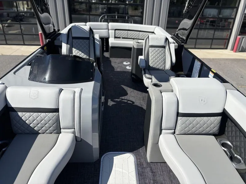 Slide: The Image of 2026 Godfrey AquaPatio 255 ULC pontoon boat interior with luxurious seating and modern design. - 4