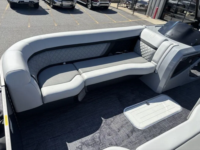 Slide: The Image of 2026 Godfrey AquaPatio 255 ULC boat interior with luxurious seating and modern design. - 6