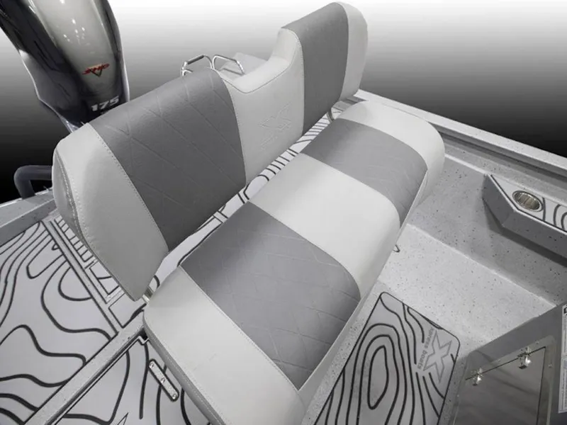 Slide: The Image of 2026 Xpress H22 Bay boat interior with gray and white seating and patterned flooring. - 3