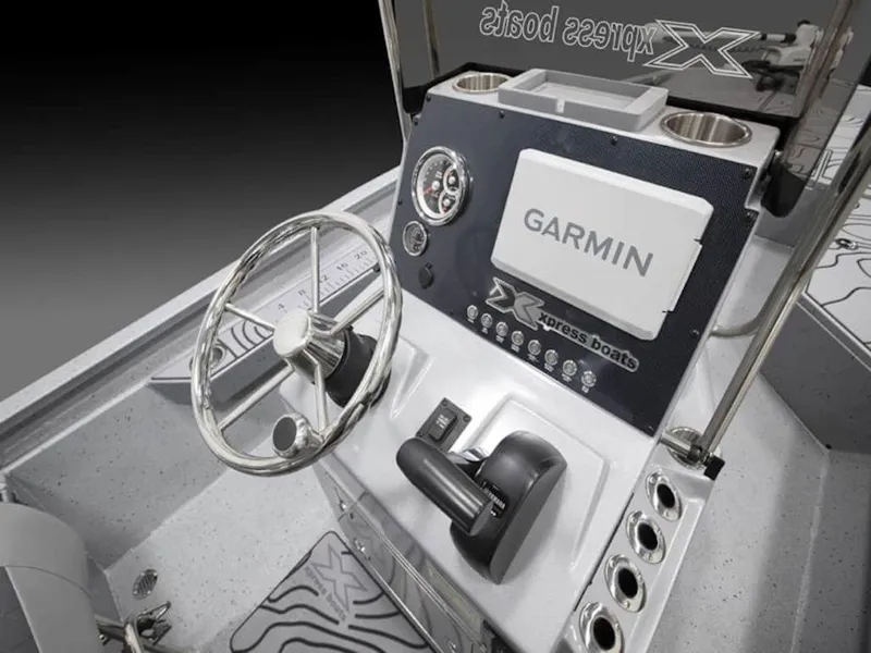 Slide: The Image of 2026 Xpress H22 Bay boat console with Garmin navigation system and steering wheel. - 4