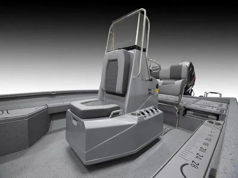 Slide: The Image of 2026 Xpress H22 Bay boat interior with seating and console, showcasing modern design. - 7