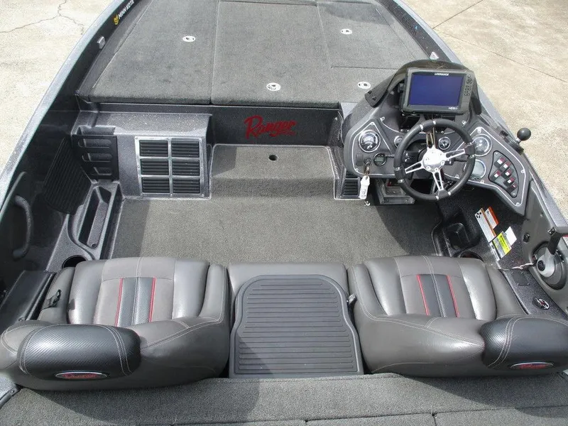 Slide: The Image of 2012 Ranger Z518 boat interior with steering console and seating. - 8