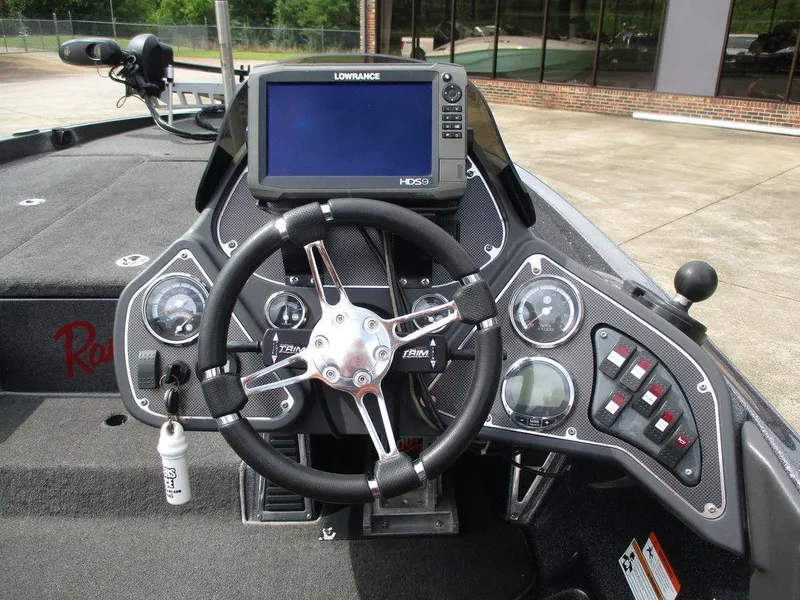 Slide: The Image of 2012 Ranger Z518 boat dashboard with steering wheel and Lowrance HDS9 display. - 9