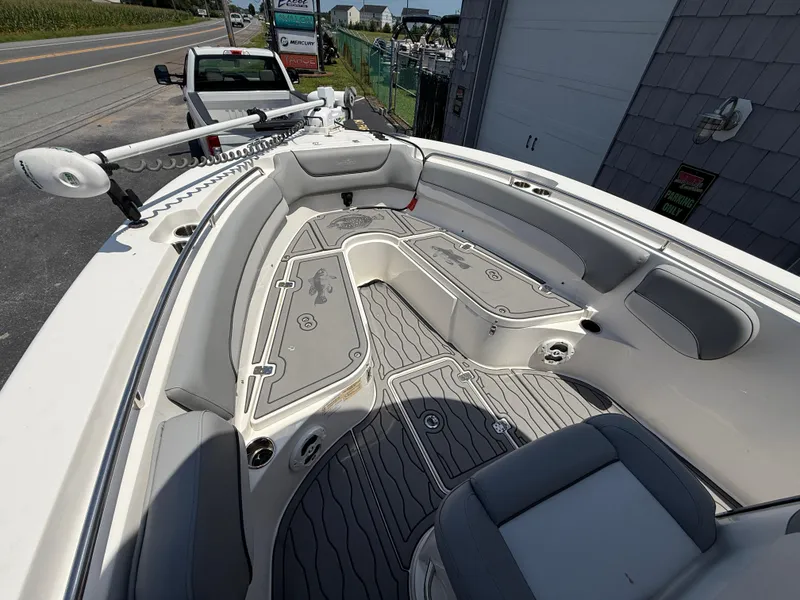 Slide: The Image of 2022 NauticStar 2602 Legacy boat interior with seating and deck details. - 29