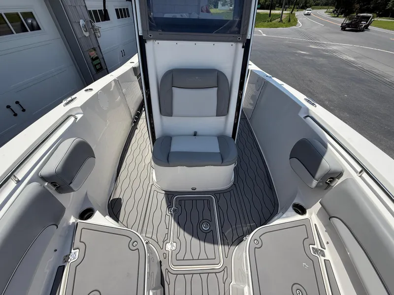 Slide: The Image of 2022 NauticStar 2602 Legacy boat interior with gray seating and flooring. - 34