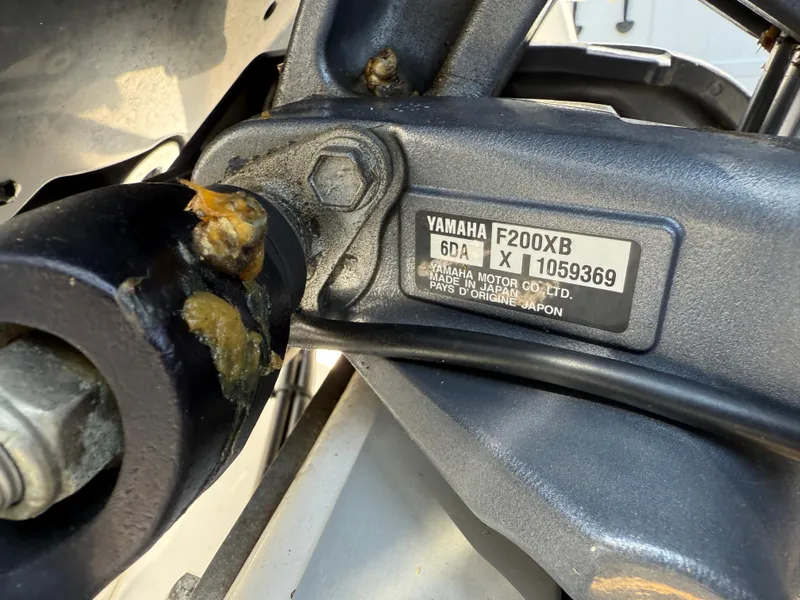 Slide: The Image of Close-up of Yamaha F200XB engine part on 2022 NauticStar 2602 Legacy boat. - 39