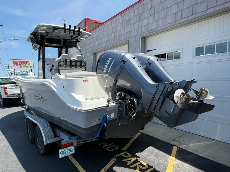 Slide: The Image of 2022 NauticStar 2602 Legacy boat with Yamaha engines on a trailer. - 6