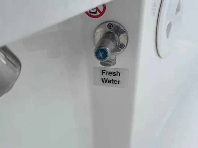 Slide: The Image of Fresh water outlet on 2021 Regulator 26XO boat. - 18