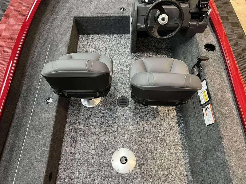 Slide: The Image of 2026 Tracker Super Guide™ V-16 SC boat interior with two gray seats and steering console. - 5