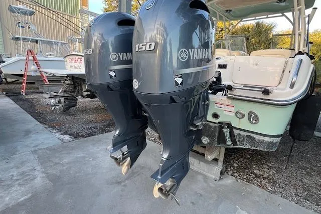 Slide: The Image of 2021 Grady-White Freedom 255 boat with dual Yamaha 150 outboard engines. - 14