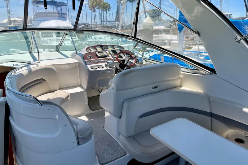 Slide: The Image of 2005 Chaparral Signature 350 boat interior with helm, seating, and table. - 10