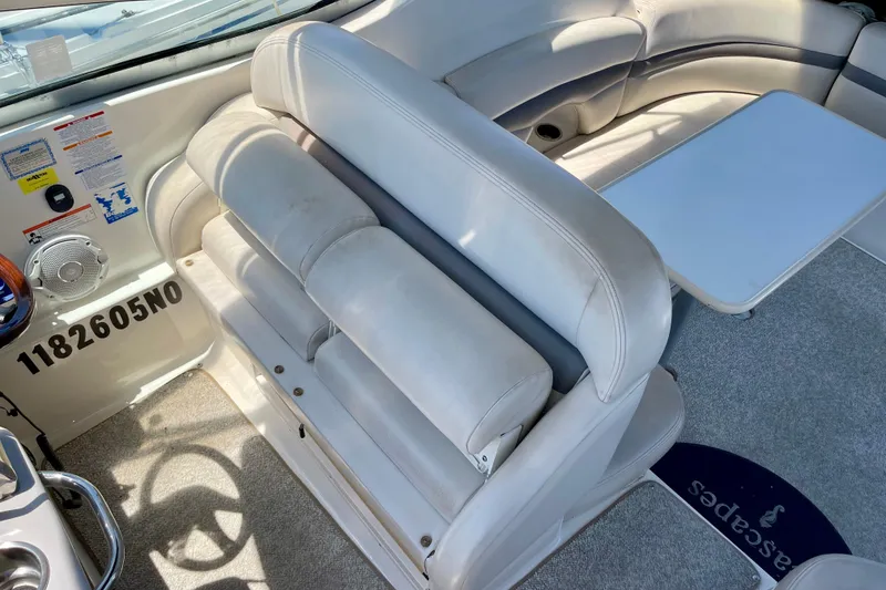 Slide: The Image of 2005 Chaparral Signature 350 boat interior with white seating and table. - 12