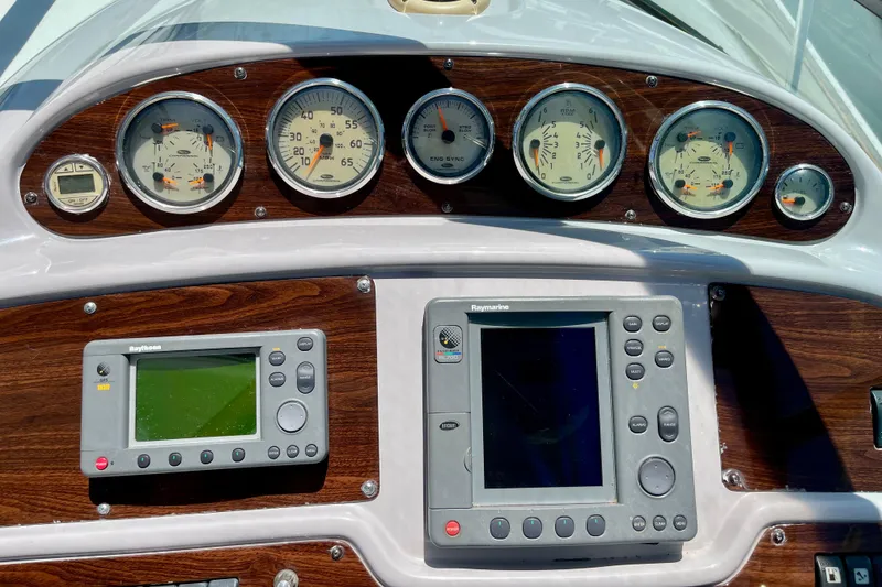 Slide: The Image of Dashboard of a 2005 Chaparral Signature 350 boat with gauges and navigation equipment. - 15
