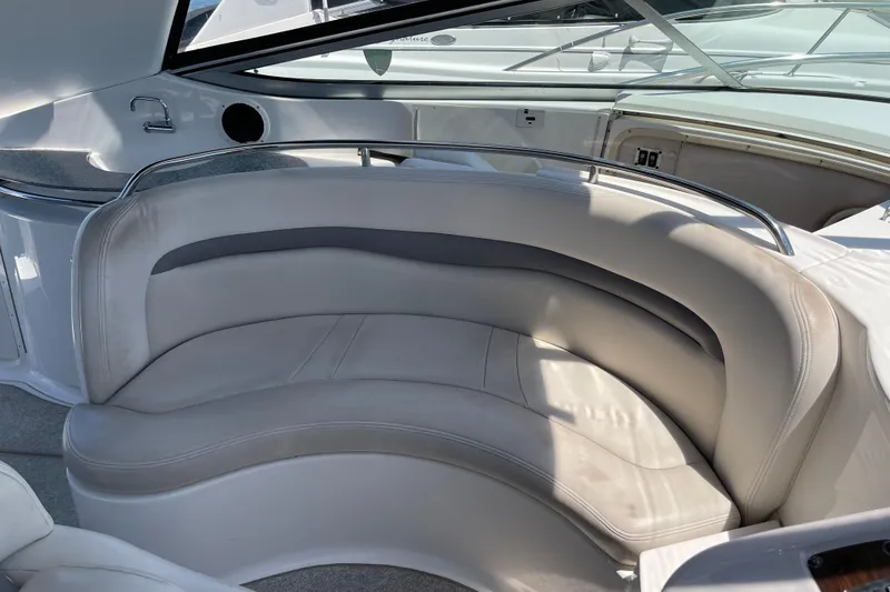 Slide: The Image of 2005 Chaparral Signature 350 boat interior with curved seating and sleek design. - 16