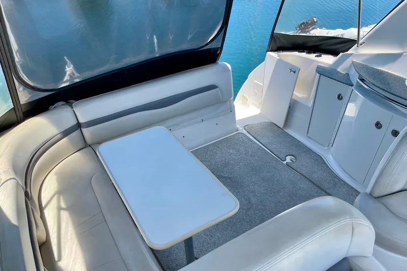 Slide: The Image of 2005 Chaparral Signature 350 boat interior with seating and table, overlooking water. - 17