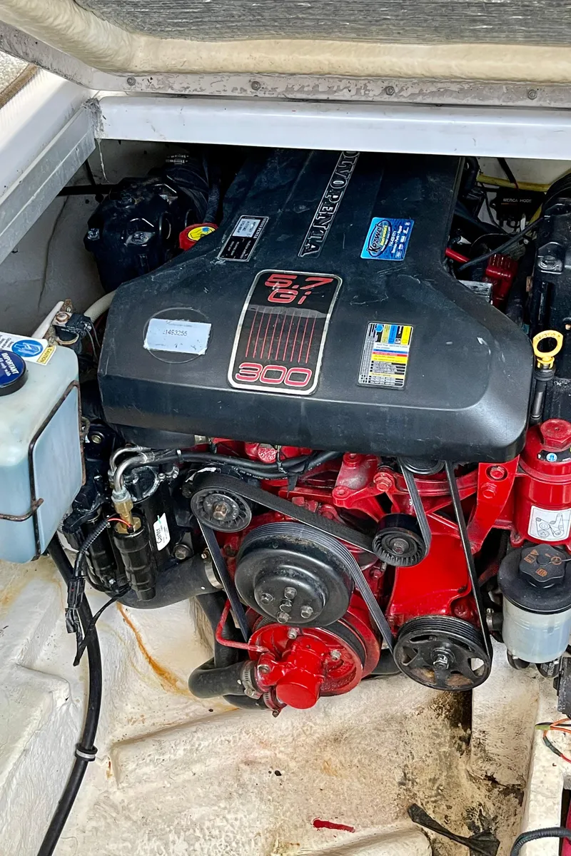 Slide: The Image of Engine compartment of a 2005 Chaparral Signature 350 boat, featuring a powerful motor. - 20