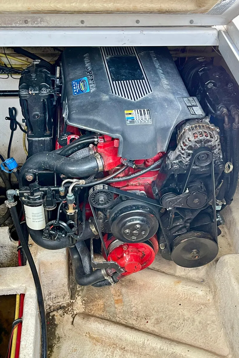 Slide: The Image of Engine compartment of a 2005 Chaparral Signature 350 boat, showcasing detailed mechanical components. - 21