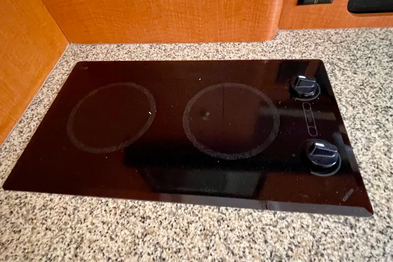 Slide: The Image of Electric stovetop with two burners in a 2005 Chaparral Signature 350 kitchen. - 25