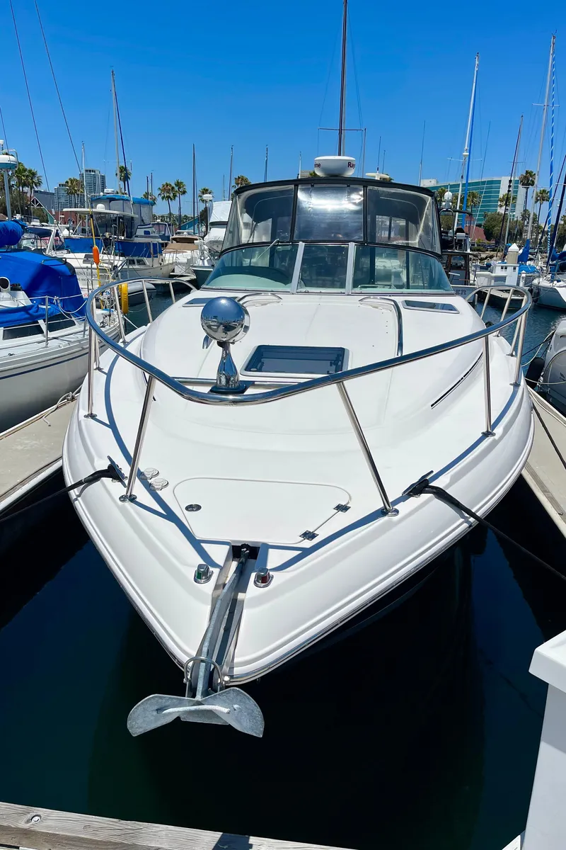 Slide: The Image of 2005 Chaparral Signature 350 boat docked in marina under clear blue sky. - 3