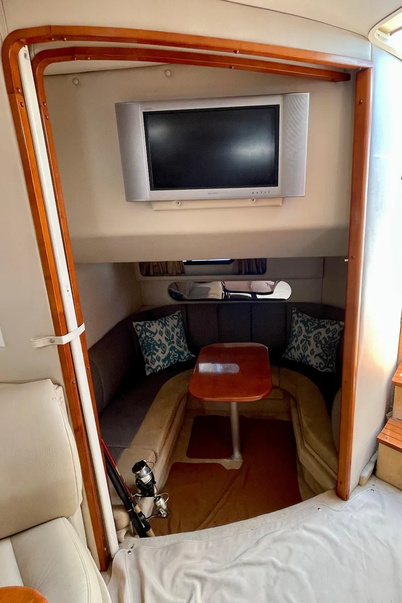 Slide: The Image of Interior of 2005 Chaparral Signature 350 boat with TV and cozy seating area. - 30