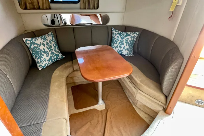Slide: The Image of 2005 Chaparral Signature 350 interior with cozy seating and wooden table. - 31