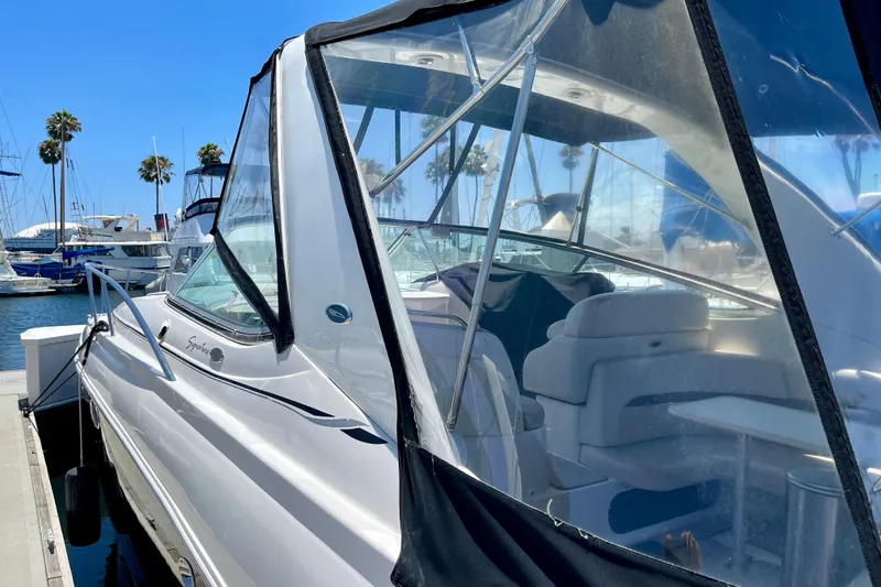 Slide: The Image of 2005 Chaparral Signature 350 yacht docked at marina under clear blue sky. - 5