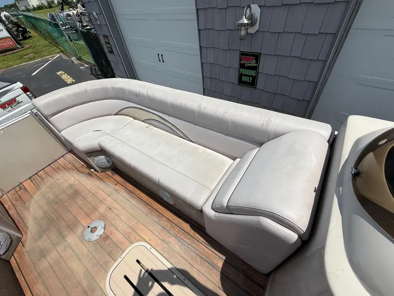 Slide: The Image of 2014 Avalon 2585 Catalina Bar with white seating and wooden deck. - 15