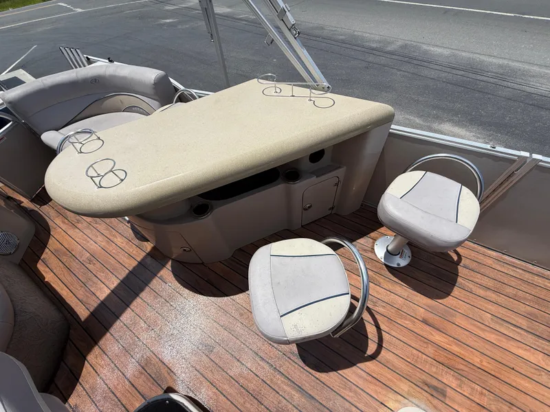 Slide: The Image of 2014 Avalon 2585 Catalina Bar with seating and table on wooden deck. - 22