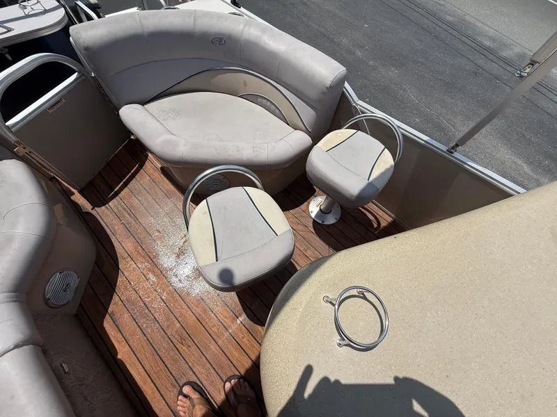 Slide: The Image of 2014 Avalon 2585 Catalina Bar interior with seating and wooden deck. - 24