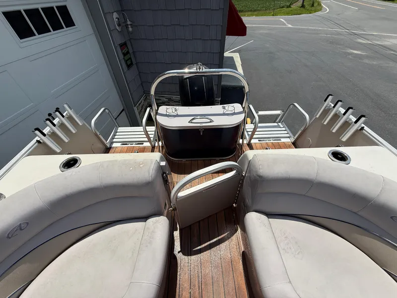 Slide: The Image of 2014 Avalon 2585 Catalina Bar with seating and bar area, parked near a garage. - 25