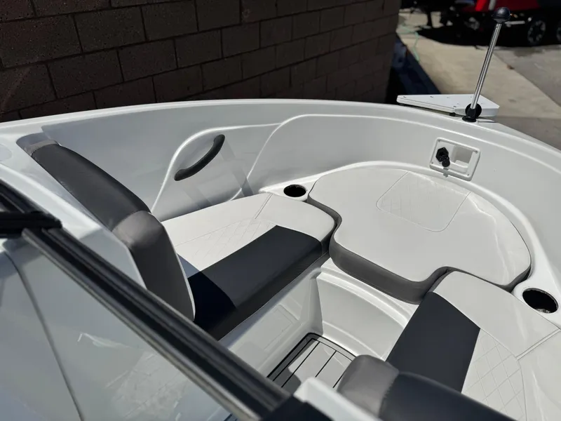 Slide: The Image of 2019 Tracker Tahoe 450 TF boat interior with cushioned seating and cup holders. - 10