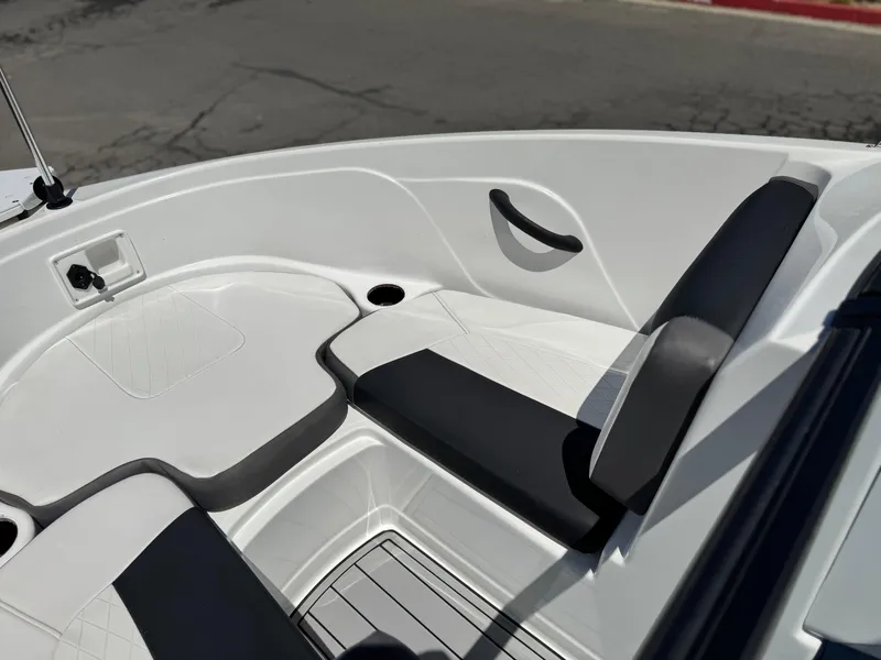 Slide: The Image of 2019 Tracker Tahoe 450 TF boat interior with white and black seating. - 11