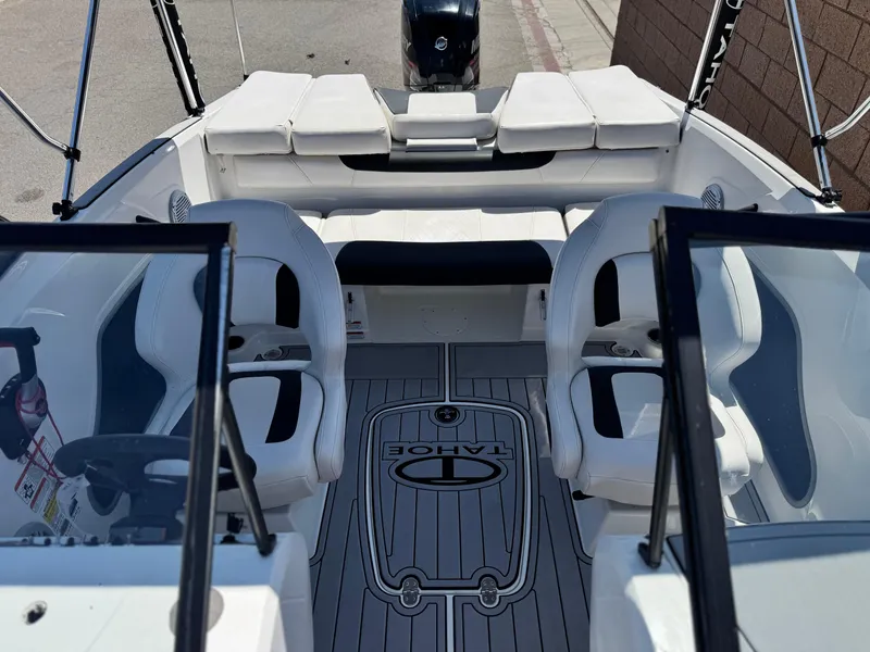Slide: The Image of 2019 Tracker Tahoe 450 TF boat interior with seating and steering wheel. - 12