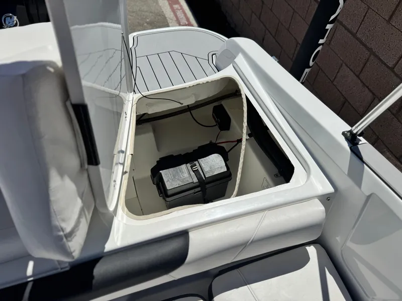 Slide: The Image of 2019 Tracker Tahoe 450 TF boat battery compartment with open hatch. - 14
